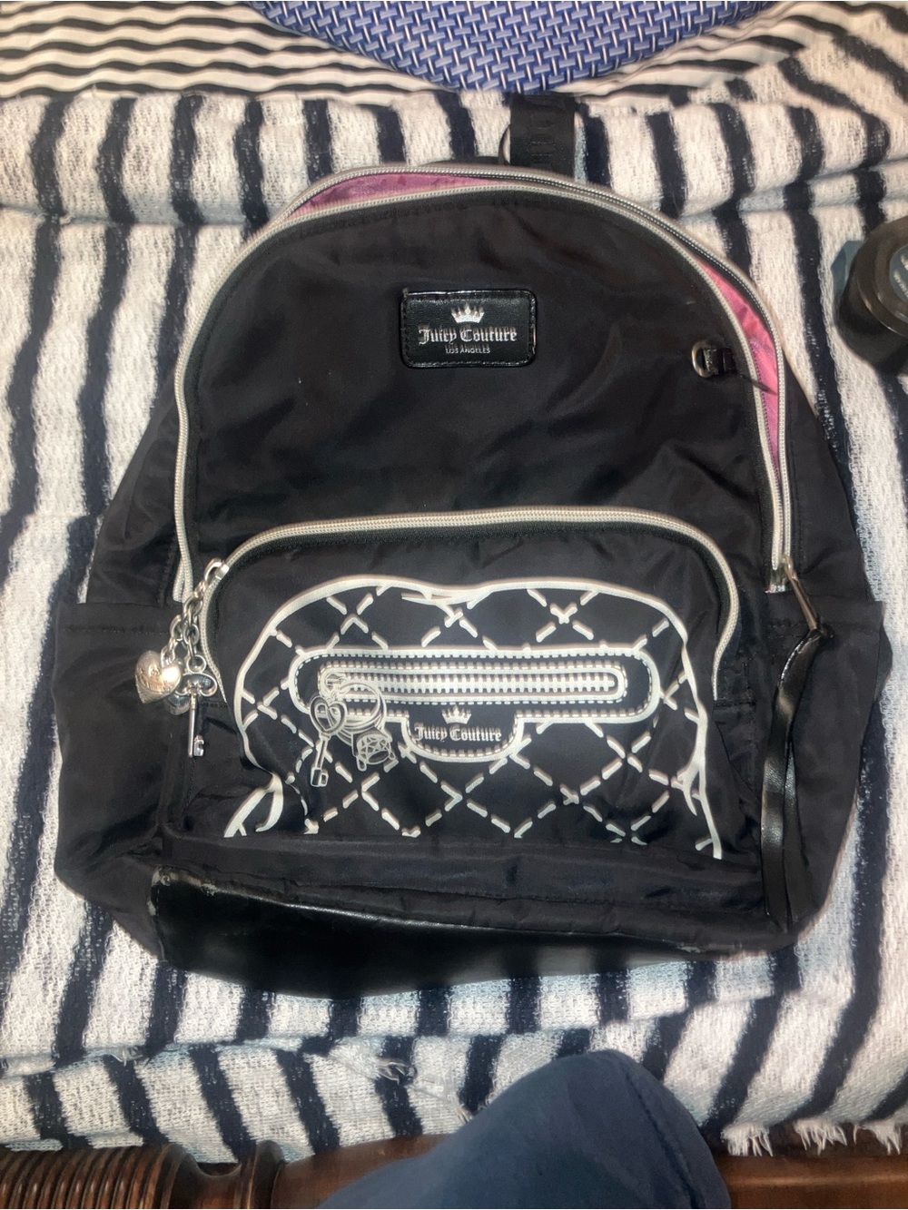 Juicy Courture  back pack black with pink lining , white graphics